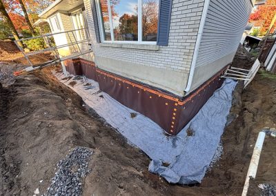 Installation de drain français tout autour des fondations à Joliette et dans la région de Lanaudière - Mini Excavation Joliette